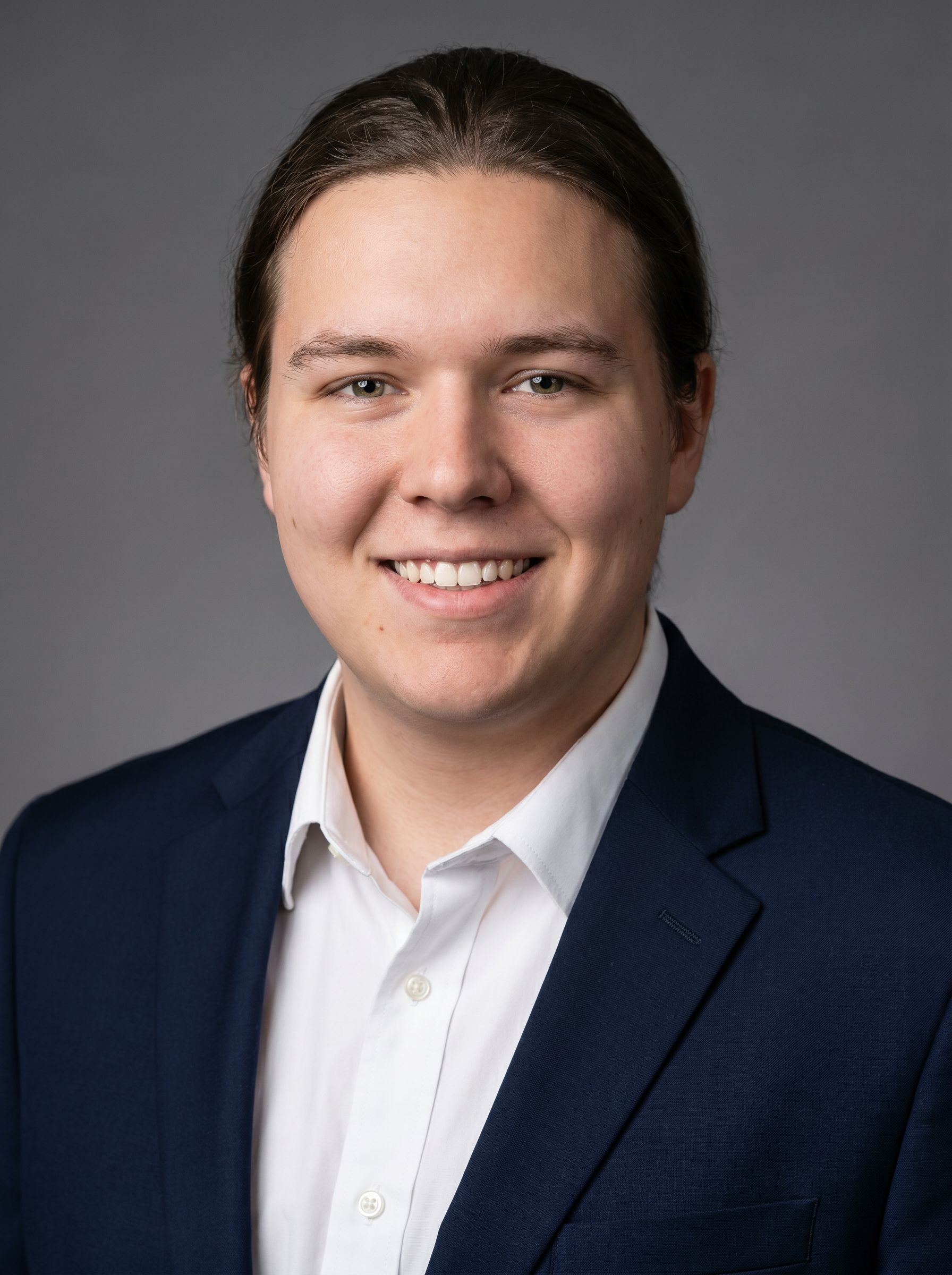 NanoBanana Pro result: polished professional corporate headshot with studio lighting, sharp focus, and executive portrait quality for pitch decks