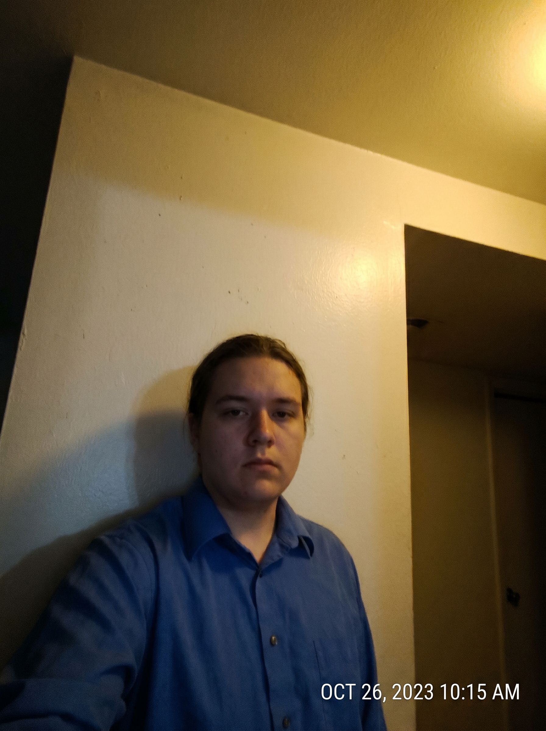 Casual portrait before NanoBanana Pro — soft focus, uneven lighting, and plain background, not studio headshot quality